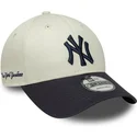 new-era-curved-brim-9forty-side-script-new-york-yankees-mlb-beige-and-navy-blue-adjustable-cap