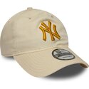 new-era-curved-brim-golden-logo-9twenty-league-essential-new-york-yankees-mlb-beige-adjustable-cap